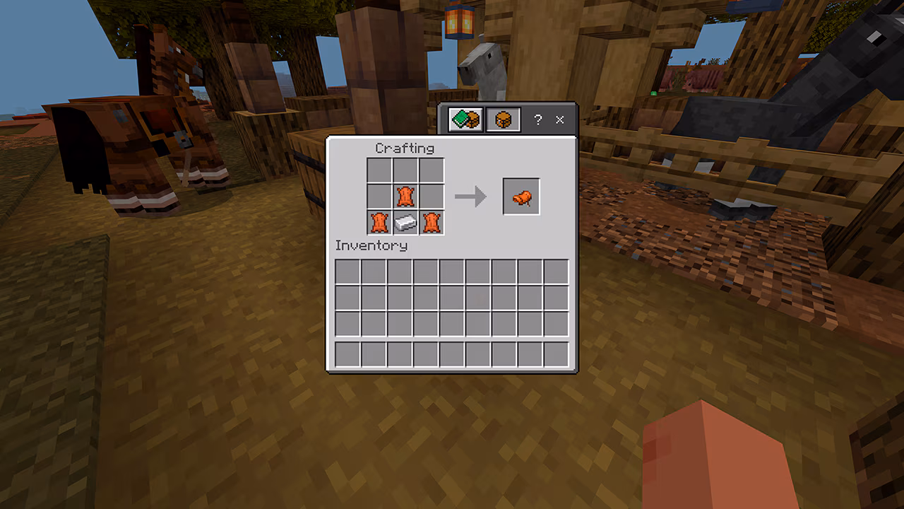 Minecraft crafting interface showing three leather and one iron ingot making a saddle